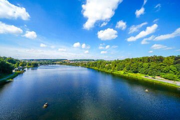 View from the historic dam wall at Möhnesee. Möhne Dam with the surrounding nature on the lake.
