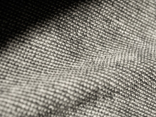 Macro photography of fabric texture, detailing soft waves and patterns, creating an impression of...