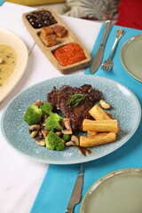 Grilled Steak with Broccoli, Mushrooms, and Yuca Fries