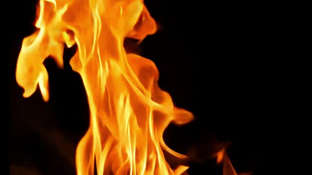 Slow motion speed close up scene of moving burning pattern as background. hot as inferno flame, abstract beautiful fire texture, black smoke from petroleum oil ignition