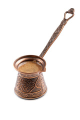 Сopper cezve with coffee isolated on white background. Turkish coffee brewing pot.