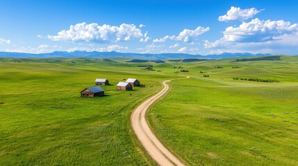Naklejka premium Scenic Countryside Landscape with Rustic Cabins and Winding Dirt Road