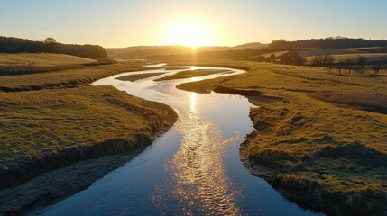 Captivating Sunset Landscape with Meandering River in Tranquil Pastoral Setting