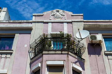 Beautiful old building with stucco decoration in the city center of Burgas, Bulgarian Black Sea coast, partial facade view
