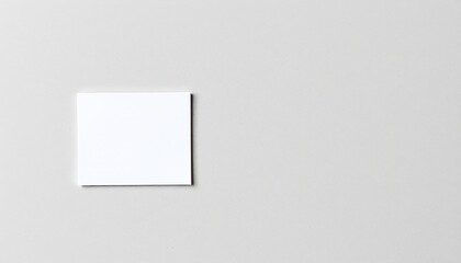 Blank white paper sheet on a plain white background with subtle shadows for a clean and minimal design