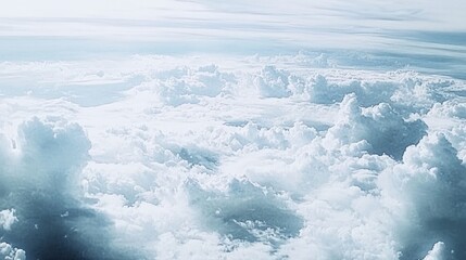 Obraz premium Soft Clouds Fill the Sky During a Serene Flight Above the Landscape, Showcasing the Beauty of Nature and Vastness of the Atmosphere at Mid-Day