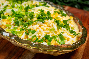 Herring salad in mustard and egg sauce.