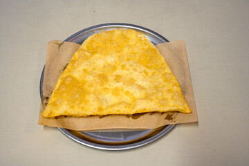 Turkish style meat stuffed filo dough borek served kol boregi.Cheese and minced pie are sliced on a marble background. Turkish name: Kol Boregi, kiymali, peynirli su boregi. Ci borek. Kafkas cig borek