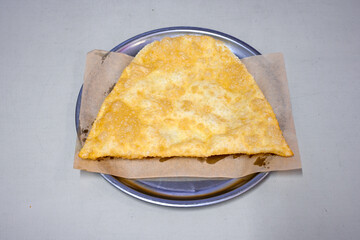 Turkish style meat stuffed filo dough borek served kol boregi.Cheese and minced pie are sliced on a marble background. Turkish name: Kol Boregi, kiymali, peynirli su boregi. Ci borek. Kafkas cig borek