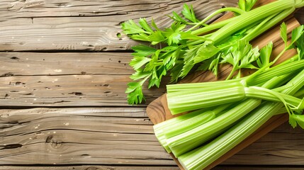Freshly Cut Celery Stalks Arranged on Wooden Table Board - Vegetarian Cooking Concept