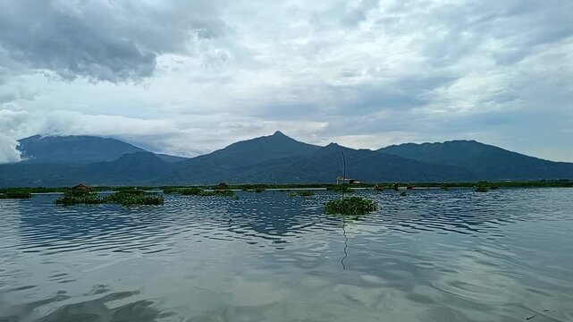 footage of the view of Rawa Pening Lake from a boat sailing in the afternoon