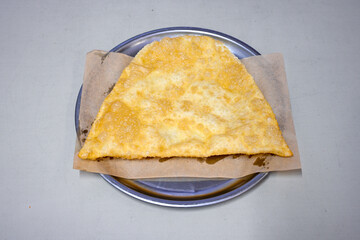 Turkish style meat stuffed filo dough borek served kol boregi.Cheese and minced pie are sliced on a marble background. Turkish name: Kol Boregi, kiymali, peynirli su boregi. Ci borek. Kafkas cig borek