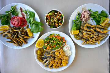 Fried Anchovies (Turkish Name: Hamsi Tava) .Hamsi, istavrit, sardalya tava. Balik kizartma. Izgara cipura levrek, palamut  yesil salata.