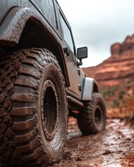 Off-road Vehicle Navigating Through Muddy Terrain at a Remote Location During Overcast Weather