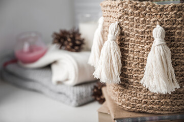 Cozy Woven Basket with Tassels and Winter Decor Elements