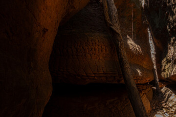 The Naga Cave in Bueng Kan, Thailand, features serpent-like rock formations tied to Naga mythology,...