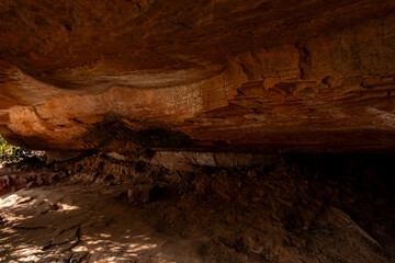 The Naga Cave in Bueng Kan, Thailand, features serpent-like rock formations tied to Naga mythology,...