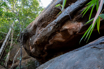 The Naga Cave in Bueng Kan, Thailand, features serpent-like rock formations tied to Naga mythology, attracting visitors to Phu Langka National Park for nature and spirituality
