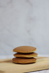 Delicious Homemade Dorayaki Pancakes Stacked on Wooden Board