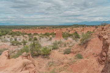 ochre canyons of the tatacoa desert on a sunny day with partial clouds