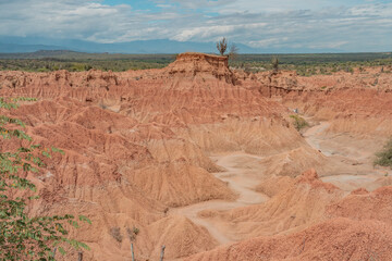 ochre canyons of the tatacoa desert on a sunny day with partial clouds