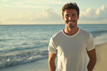 Smiling dude on beach wearing t shirt and shorts  portrait