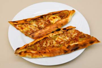 Kiymali pide.Turkish pide with minced meat. Turkish pizza mince pita Pide on white . Etli ekmek.Kusbasi kasarli, kiymali kasarli, kiymali yumurtali, Bafra, Trabzon, Kusbasili pide. Urfa acili lahmacun