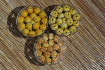 Delicious Nastar Cookies in Glass Jars on Bamboo Mat