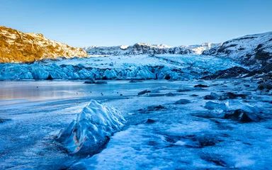 Selbstklebende Fototapeten Frozen lake and glacier Solheimajökull on a cold winter day in Iceland. Famous tourist attraction at the south coast. © Photofex