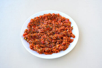 A spicy Turkish appetizer ezme made with tomatoes, bell pepper, parsley, mint, olive oil and hot chili. A kind of adjika. Kahvaltilik acuka, Antep usulu acili ezme.