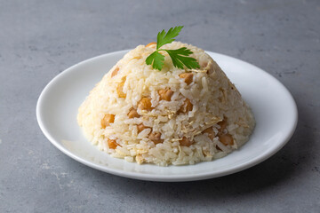 Traditional delicious Turkish food; Rice with chickpeas and chicken (Turkish name; Tavuklu nohutlu pilav or pilaf)