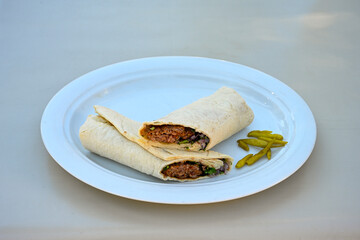 Grilled Turkish Adana, Urfa  Kebab with grilled vegetables, onion and rice on plate. Adana durum, Urfa durum .