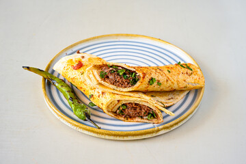 Grilled Turkish Adana, Urfa  Kebab with grilled vegetables, onion and rice on plate. Adana durum,...