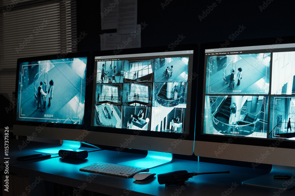 Poster Screens of desktop computers with cctv videos on screens standing in row on workplace of officers in observation room