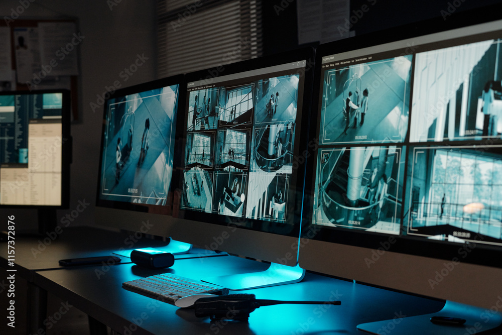 Poster Records of cctv video on screens of desktop computers standing on desks with walkie-talkie, mobile phone and keypad