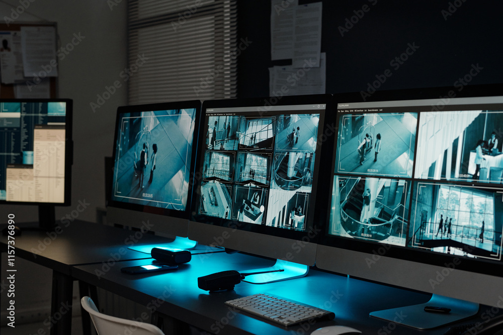 Poster workplace of absent officer of observation room with group of desktop computer monitors with cctv vi