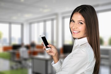 Smiling professional business woman hold smartphone