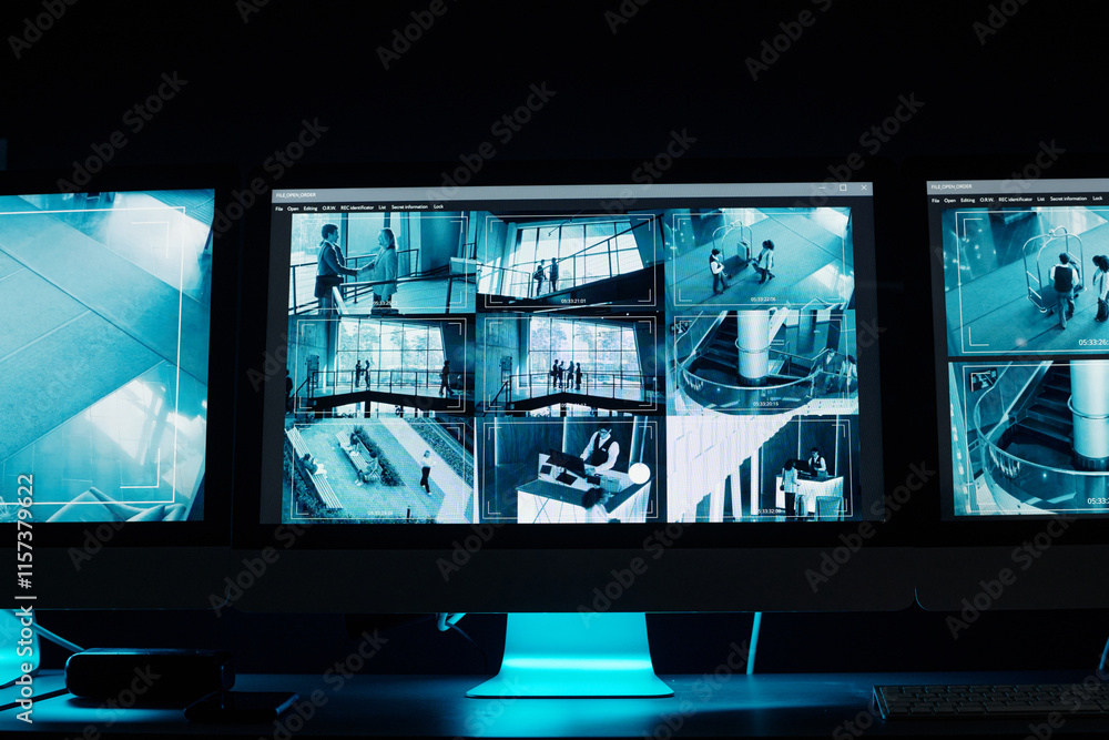 Aufkleber screens of several desktop computer monitors with cctv video records by workplace of modern security