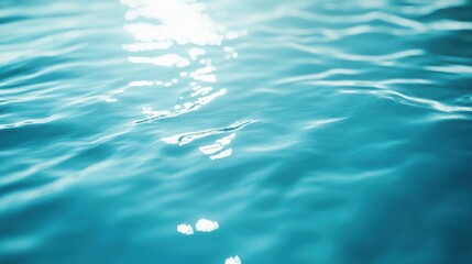 Blue water surface with sun reflection. Abstract nature background. Close up.