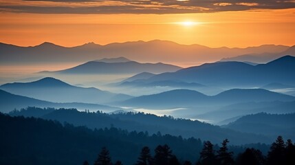 Obraz premium Vibrant sunset over mountain silhouettes with bright orange and light gray clouds creating depth