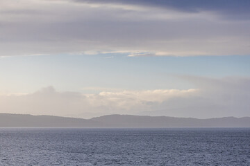 Serene Coastal View Over Gulf Islands Under a Gentle Clouded Sky