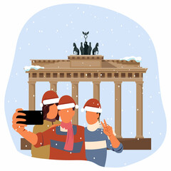 Friends take selfies near theBrandenburg Gate   on Christmas. © Svutlana