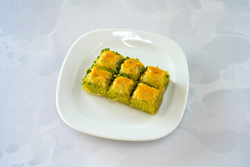 Turkish Dessert Sobiyet, havuc dilimi, midye baklava, mussels baklava and classic baklava with Pistachio . Cikolatali cevizli, fistikli soguk Baklava, top view.