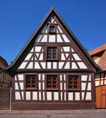 Half-timbered wooden residential house with its symmetrical gable in the old town of Kandel, Rheinland-Pfalz in Germany