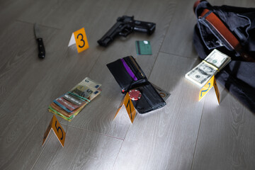 Flat lay composition with evidences and crime scene markers on wooden background