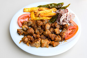 Famous Urfa meat liver, ciger wrapped by lavash with roasted chili pepper, onion and sauce in Sanliurfa, Turkey. Izgara kuzu et sis , kuzu  ciger sis durum. Arnavut cigeri. Ciger sote. Tavuk cigeri.