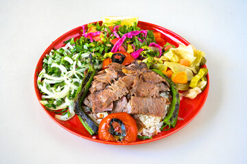 Turkish  Traditional Ramadan doner kebab with tasty tomato sauce and rice or turkish pilav in white...