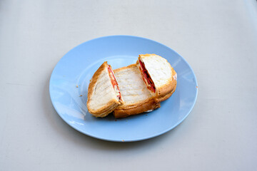 Turkish karisik atom kare  tost ( kasarli bazlama tost) . Sucuklu, Kasarli,  cheddarli, kavurmali karisik tost. Flat baked bread toasted. Karisik bazlama tost .