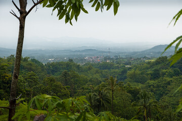 View of layered hills after rain towards the countryside