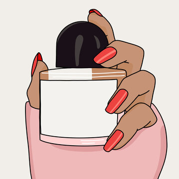 Women's hand with  Red Nails Holding a Perfume Bottle